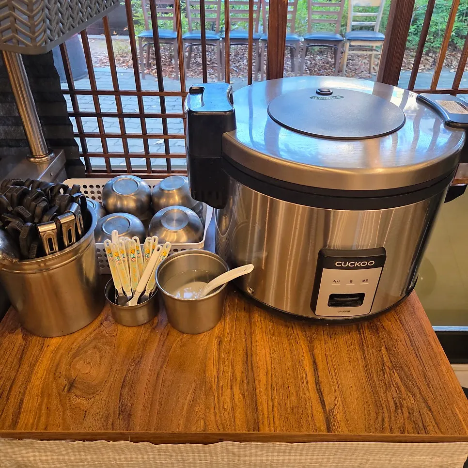 Self-serve corner with rice and a coffee machine