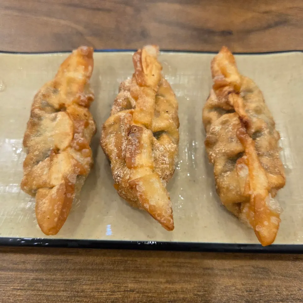 Three pieces of complimentary fried dumplings