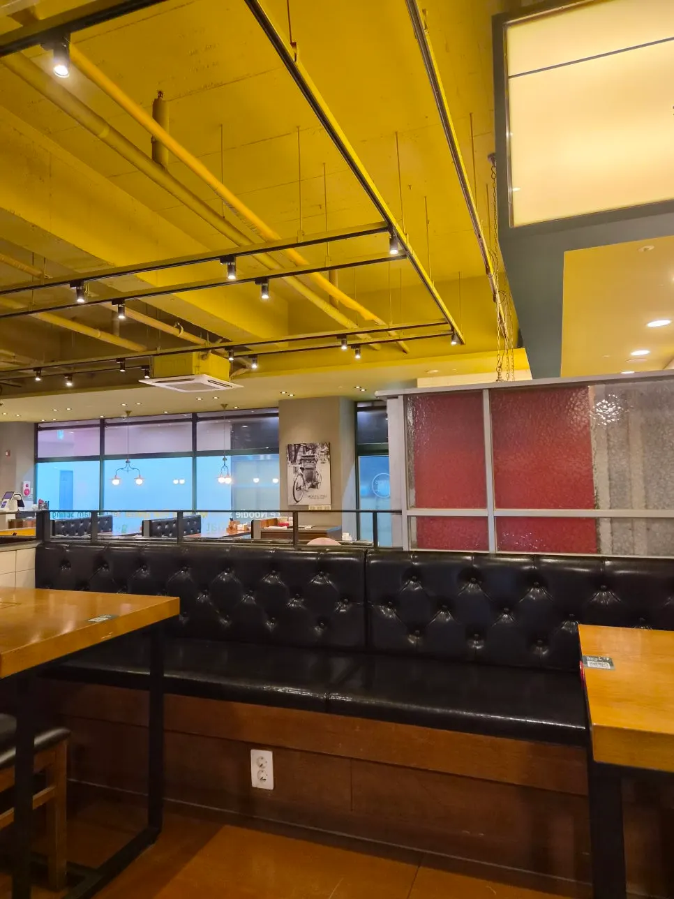 High-ceilinged interior with window-side seating