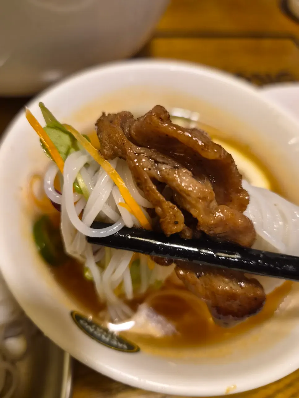 Clear beef broth with brisket slices