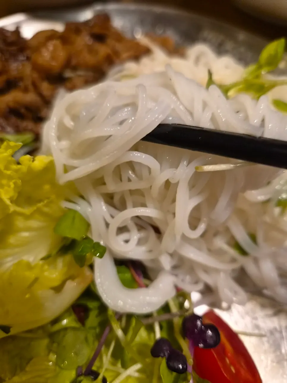Bun cha spread with vermicelli, char-grilled pork, and spring rolls