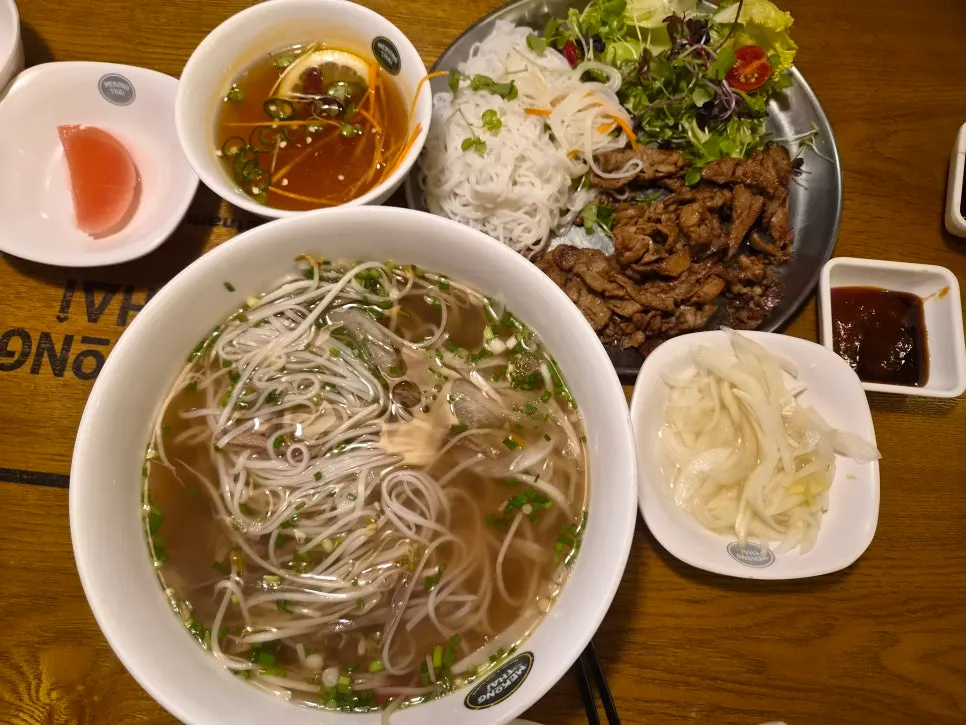 Table set with both pho and bun cha