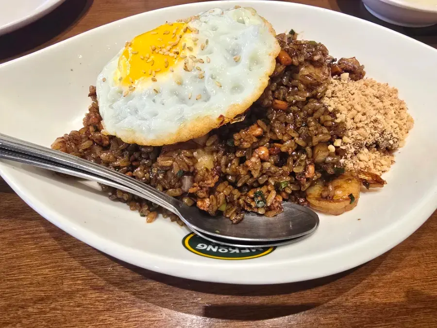 Nasi goreng topped with a fried egg and peanuts