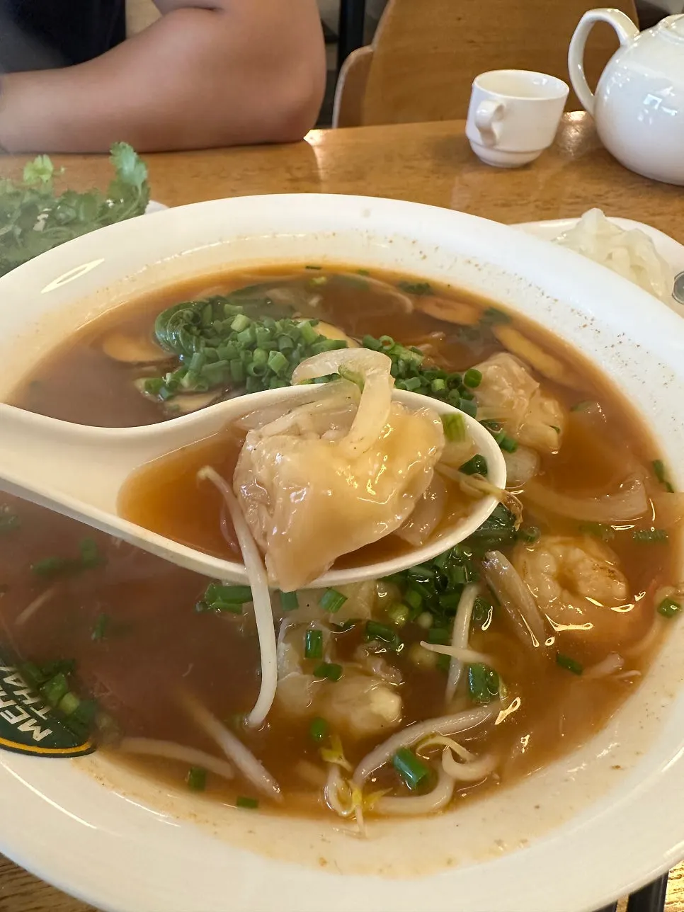 Clear, spicy broth of shrimp wonton pho