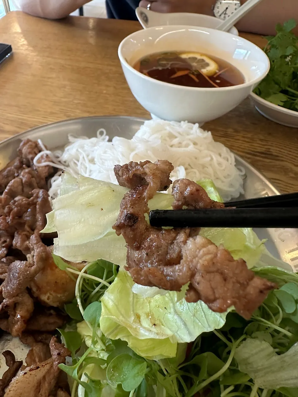 A lettuce wrap of bun cha with meat and noodles