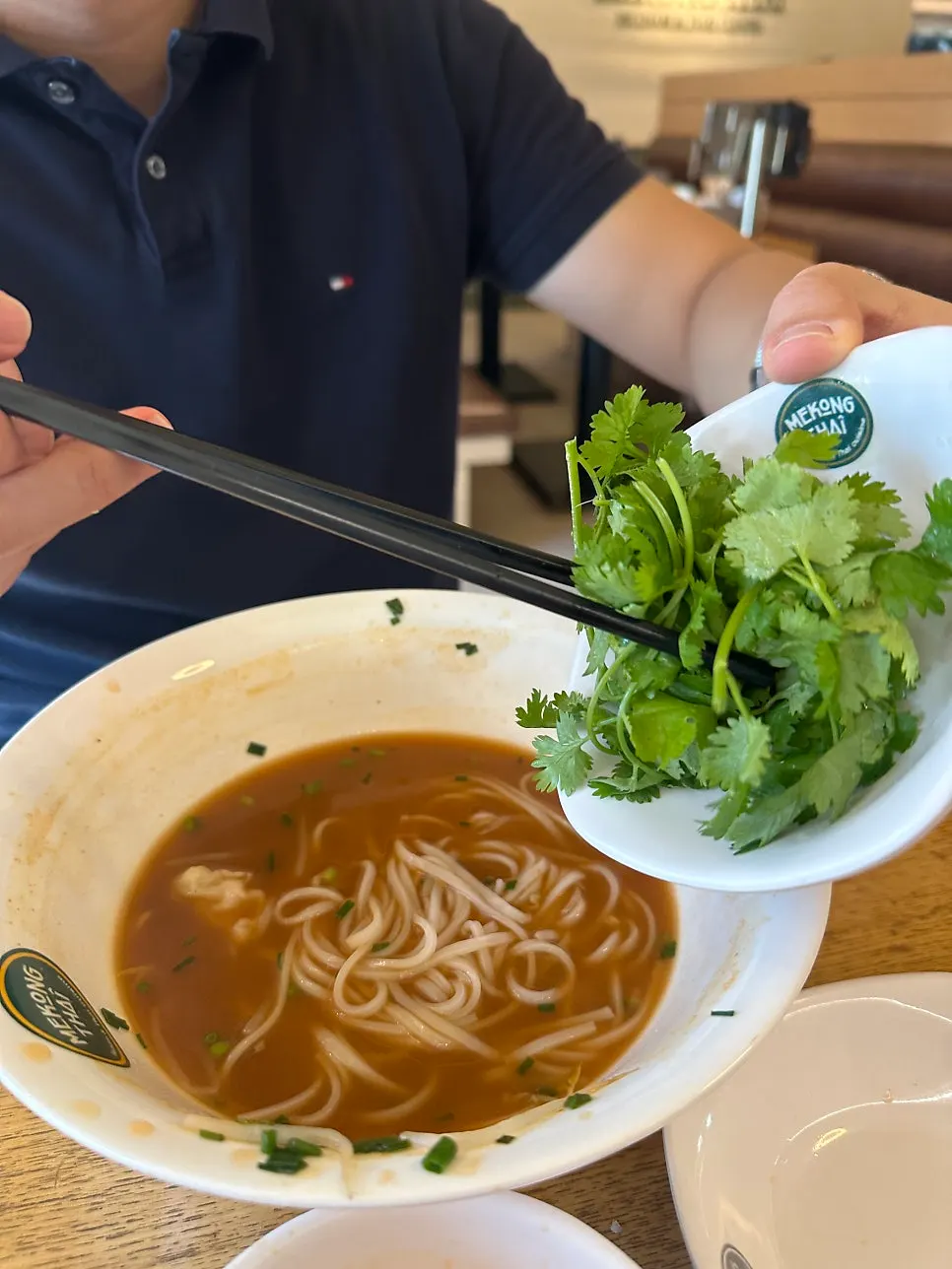 Cilantro added into the pho broth