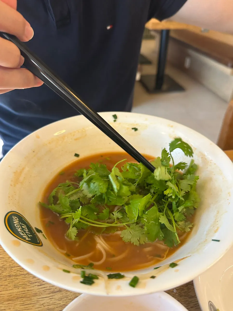 Shrimp wonton pho topped generously with cilantro