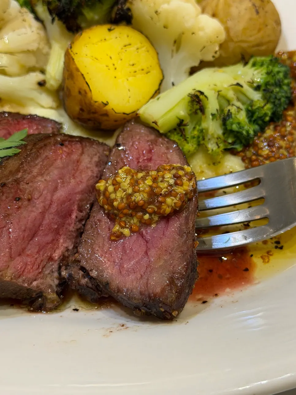 Leftover steak juices and olive oil on the plate