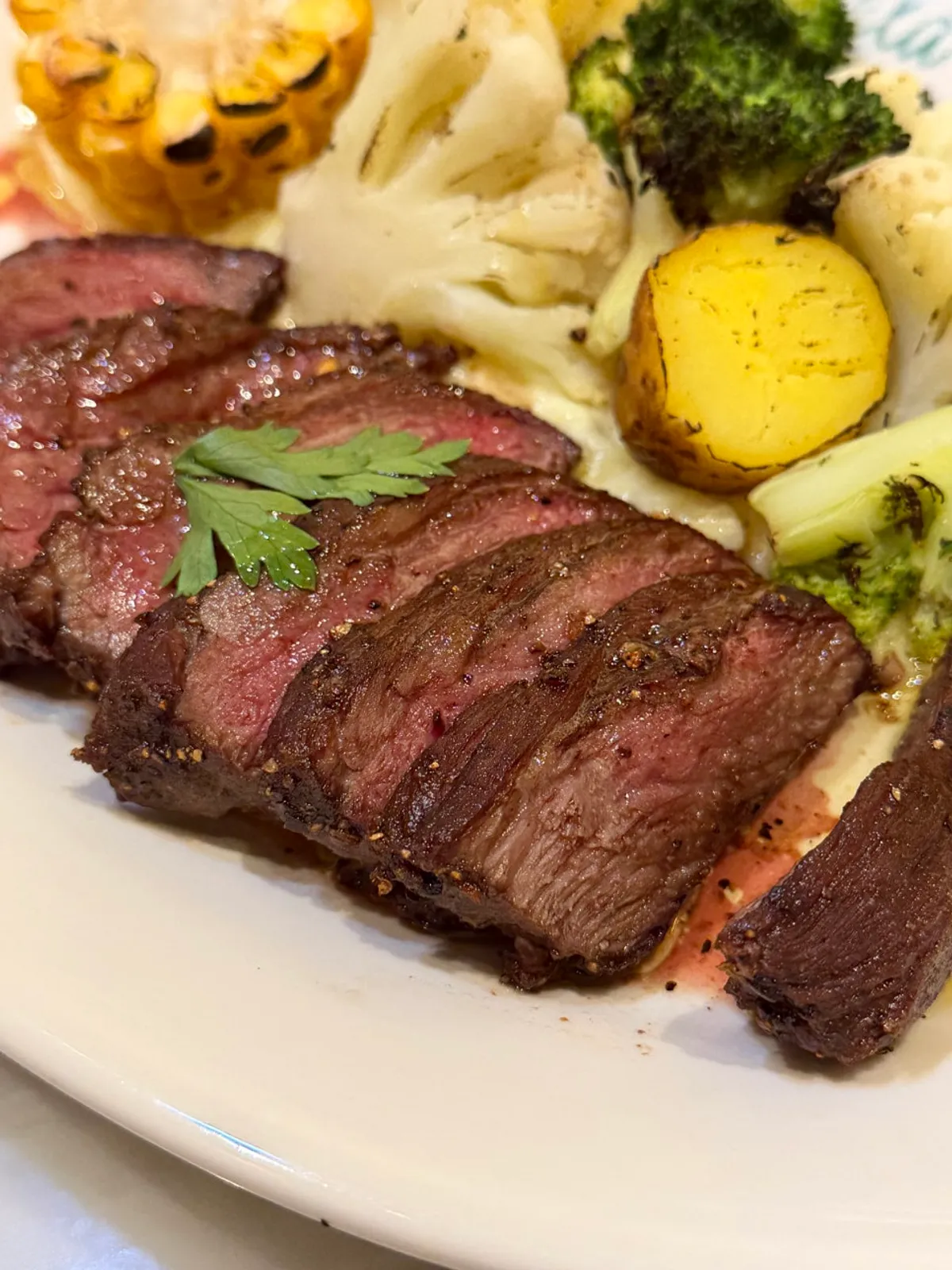 Thick chuck flap steak with garnish on the plate