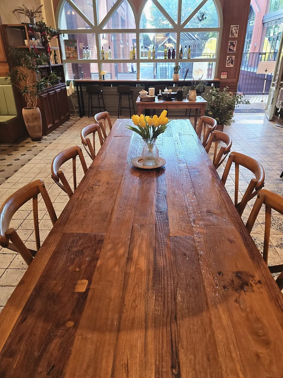 Open kitchen and table with a vase on top