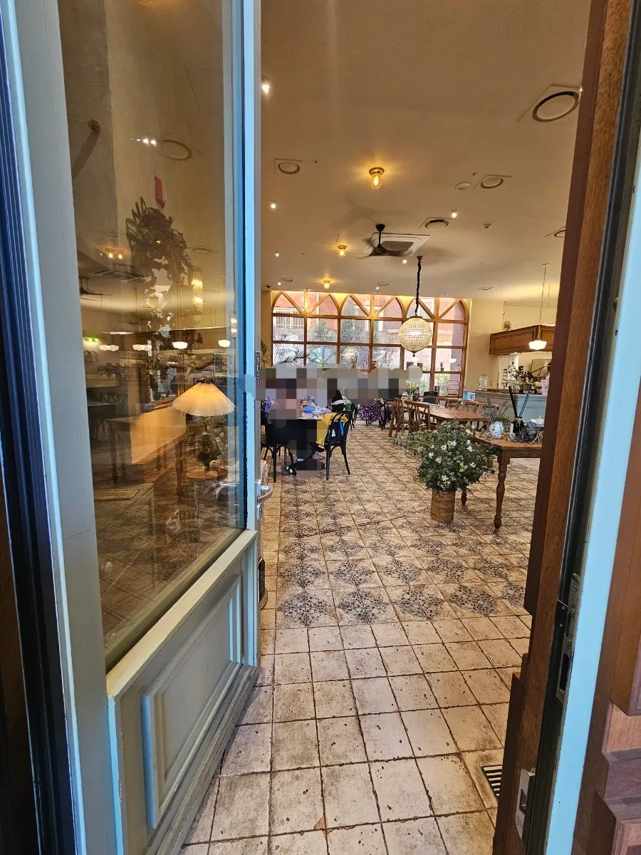 Interior of MELA Hongdae with wood-toned decor