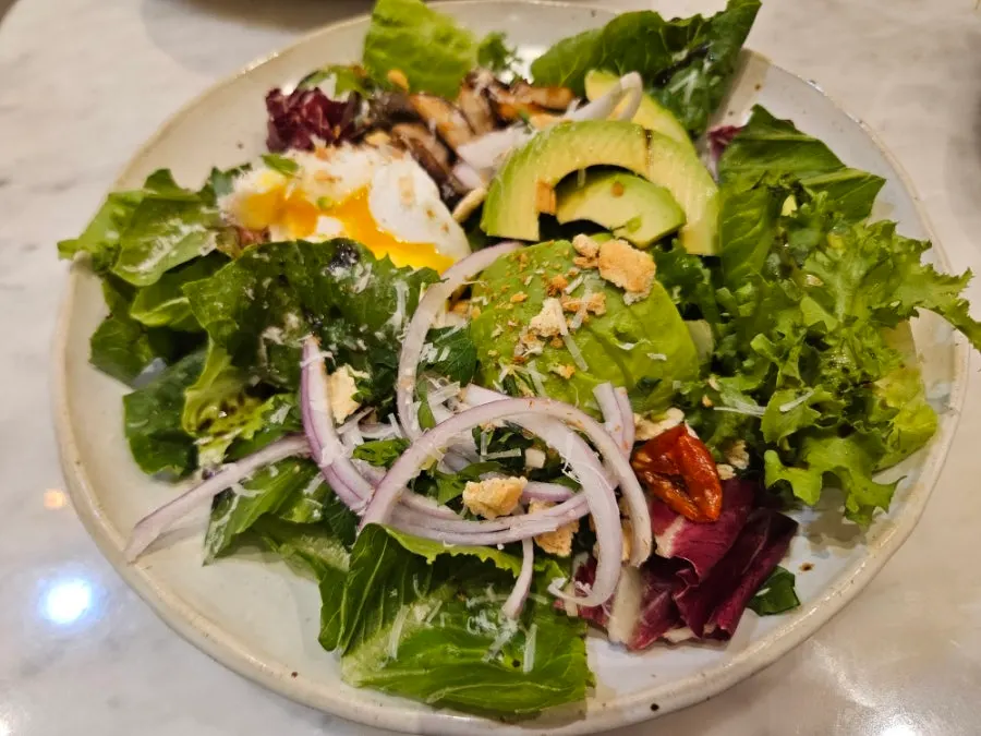 Avocado salad drizzled with balsamic dressing