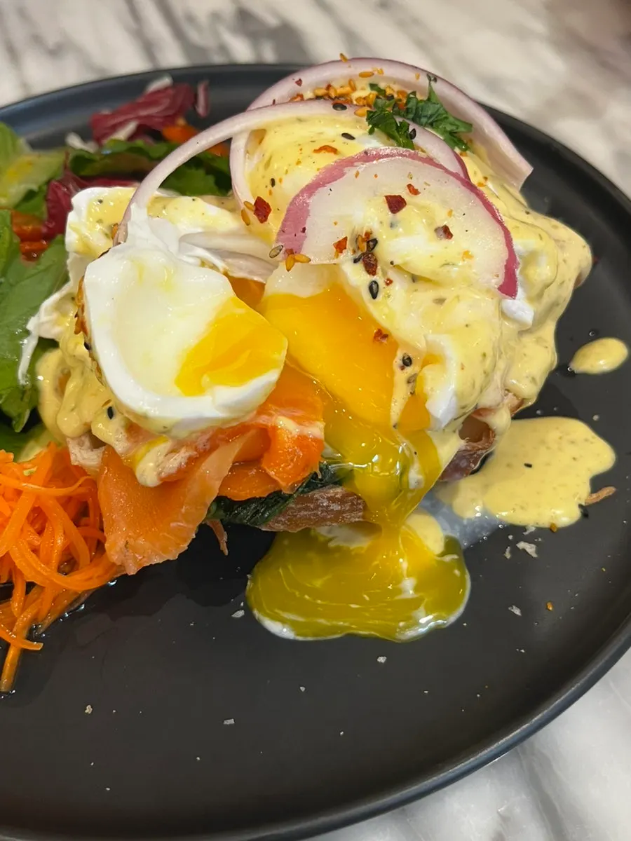 Cross-section of the salmon eggs Benedict with poached egg cut open