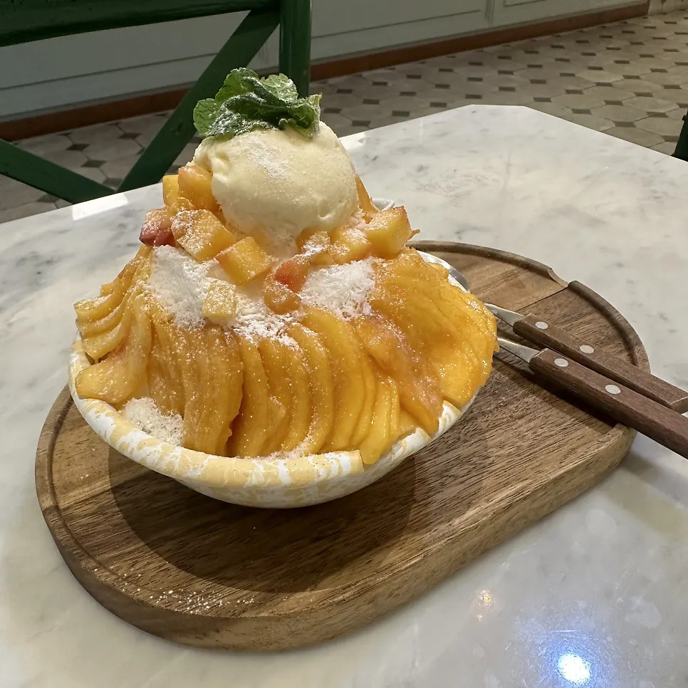 Close-up of bingsu topped with peach