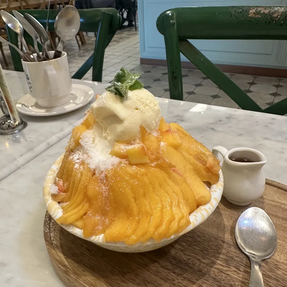 A bowl of peach bingsu eaten for dessert