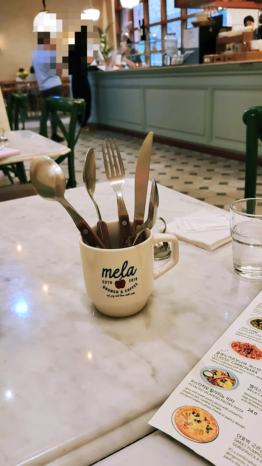 Table seat in the back corner at MELA Hongdae