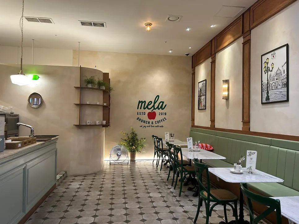 MELA Hongdae's main hall lit by natural light through floor-to-ceiling windows