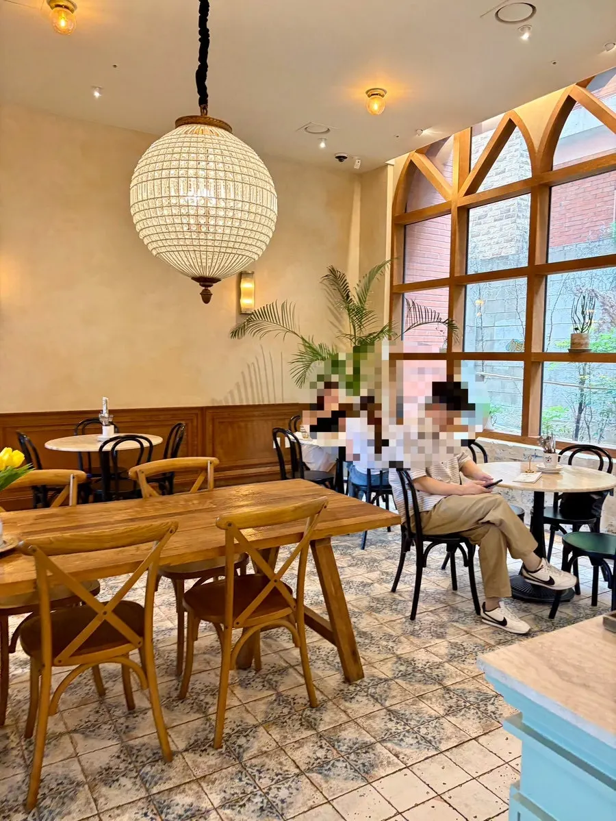 Seating at MELA Hongdae with wood tables