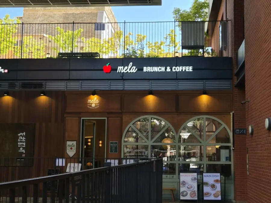 Entrance to MELA Hongdae with an apple motif visible