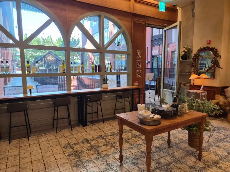 MELA Hongdae's hall divided into 2-person and 4-person tables