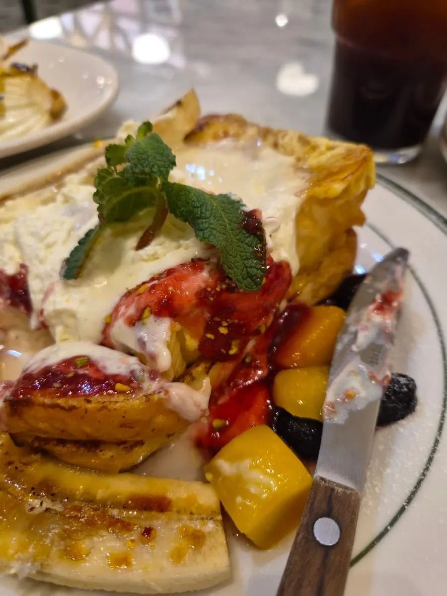 Victoria French Toast topped with banana and berries
