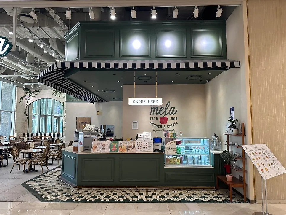 Storefront view of Mela Times Square