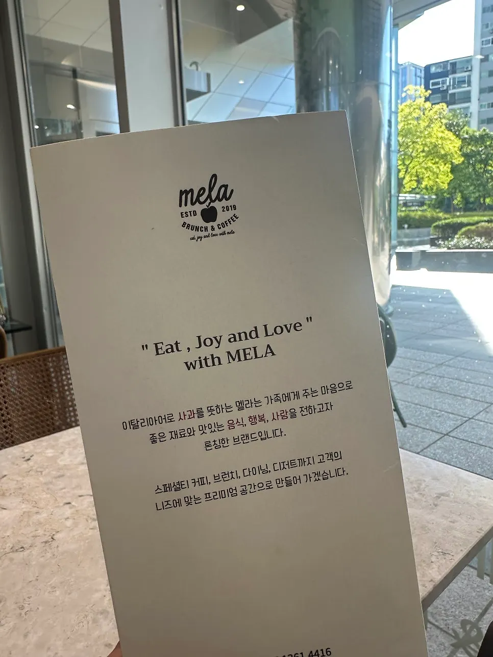 Menu board listing Mela's meal options