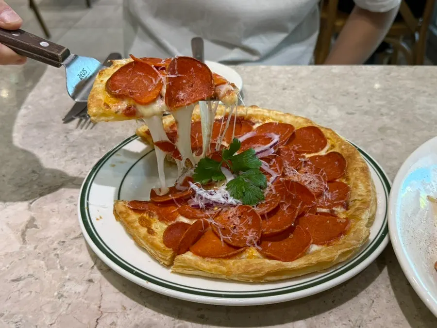Pastry-dough pepperoni pizza cut into 6 slices