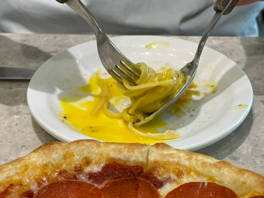 Carbonara noodles mixed with cream sauce