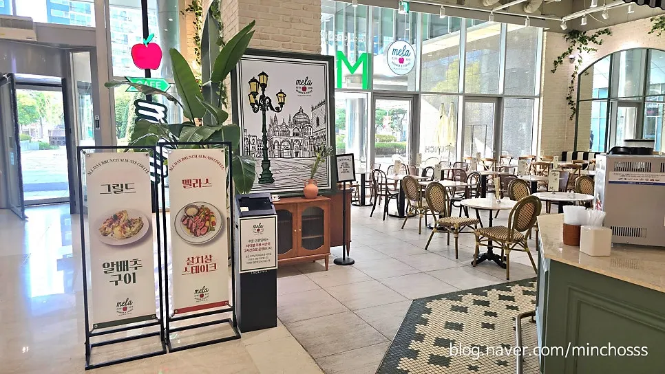 Mela's menu board set up outside the store