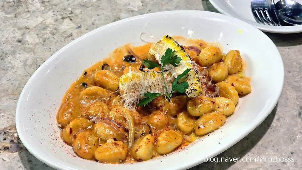 A plate of spicy rose sauce corn gnocchi
