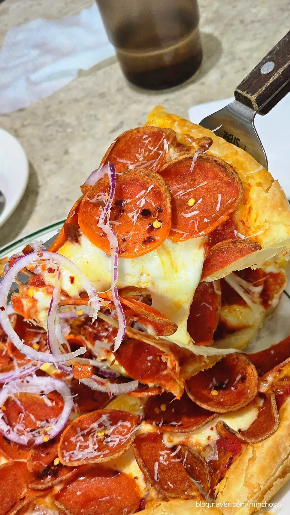 Cheese pull from the classic pepperoni pastry pizza