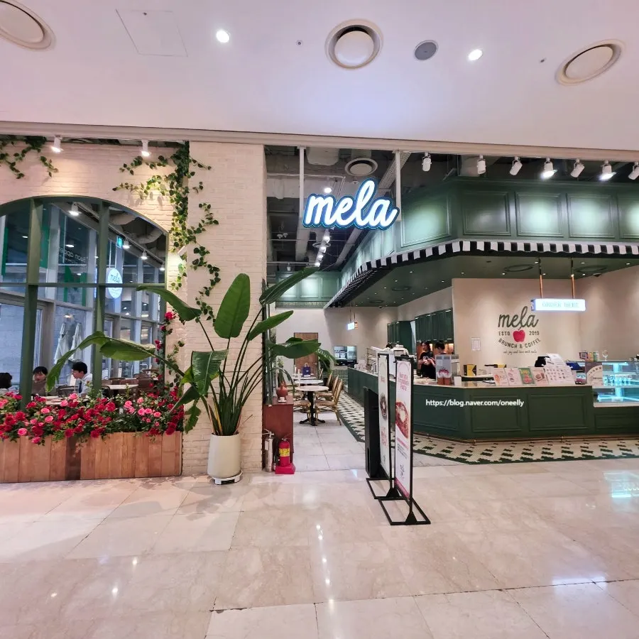 Exterior and signage of Mela Times Square