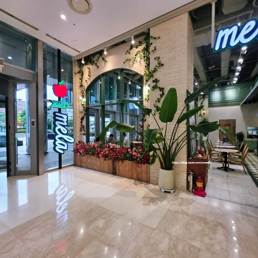 Bright interior of Mela Times Square with high ceilings