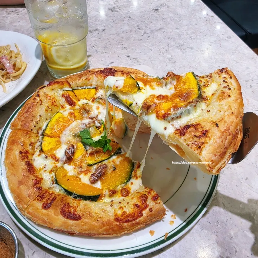 A pizza slice with stretchy cheese pull