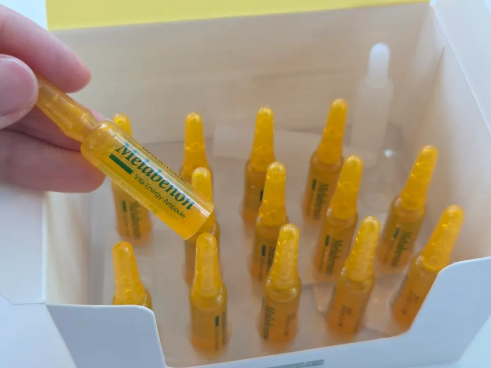Vitamin ampoules lined up with the box