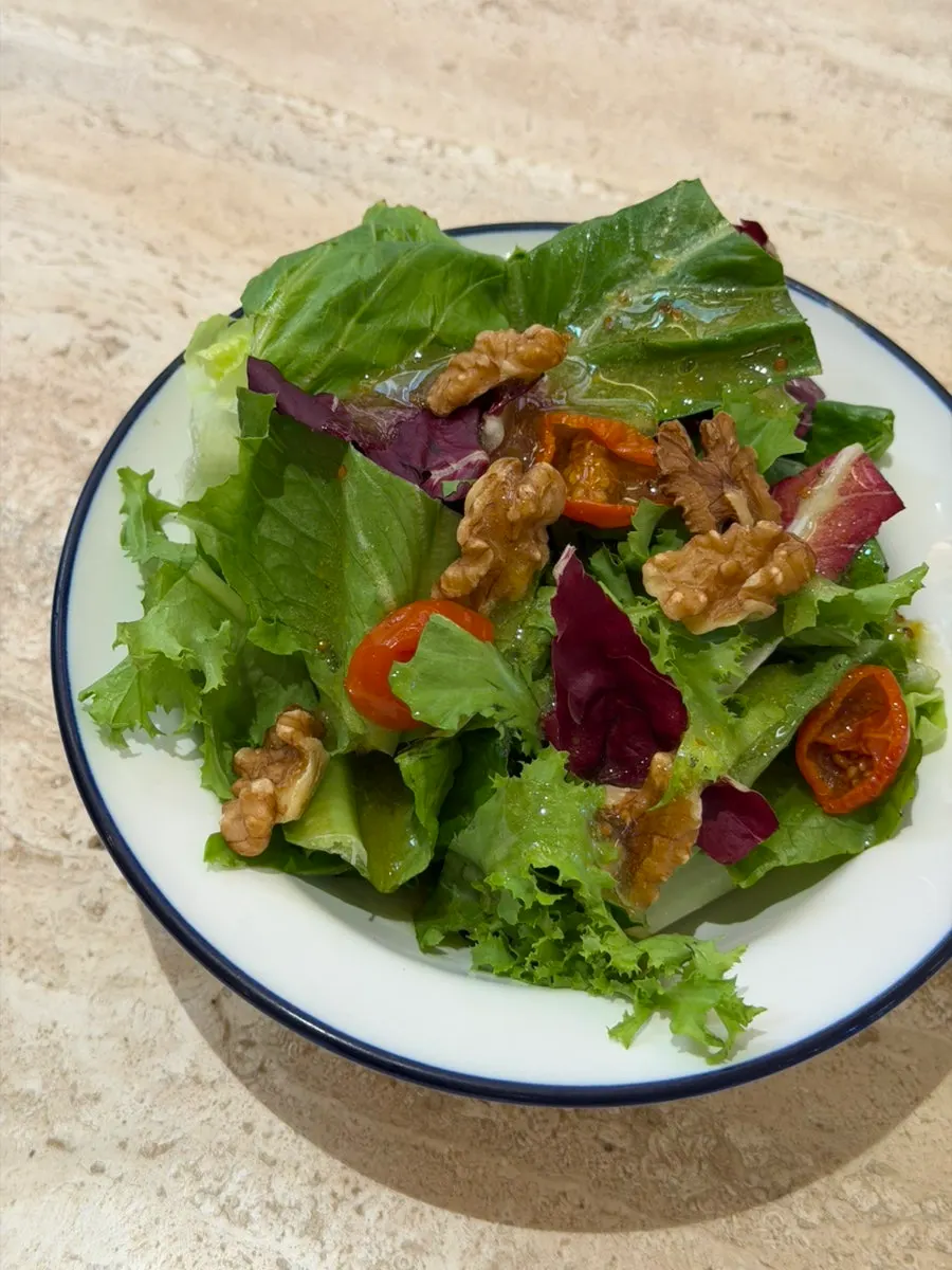 Mini salad drizzled with yuzu dressing