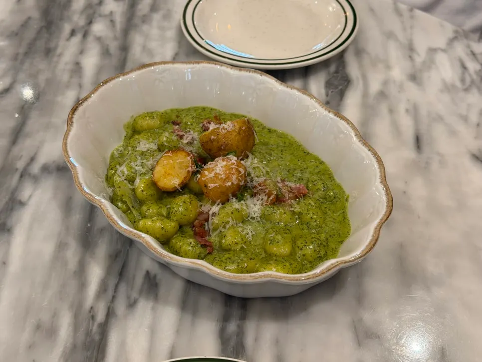 A plate of potato basil cream gnocchi