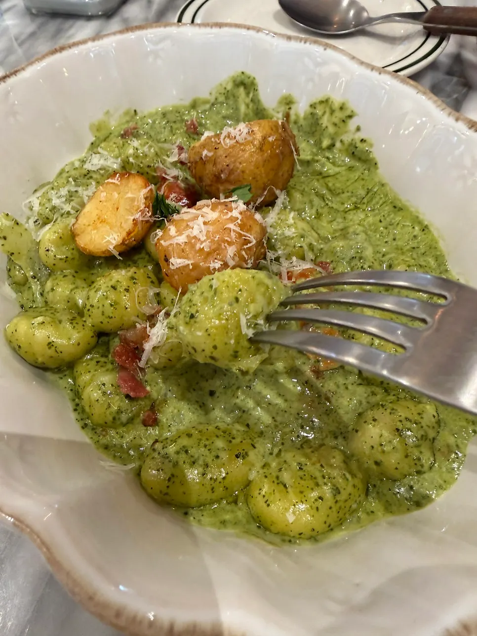 A bite of gnocchi with roasted baby potatoes