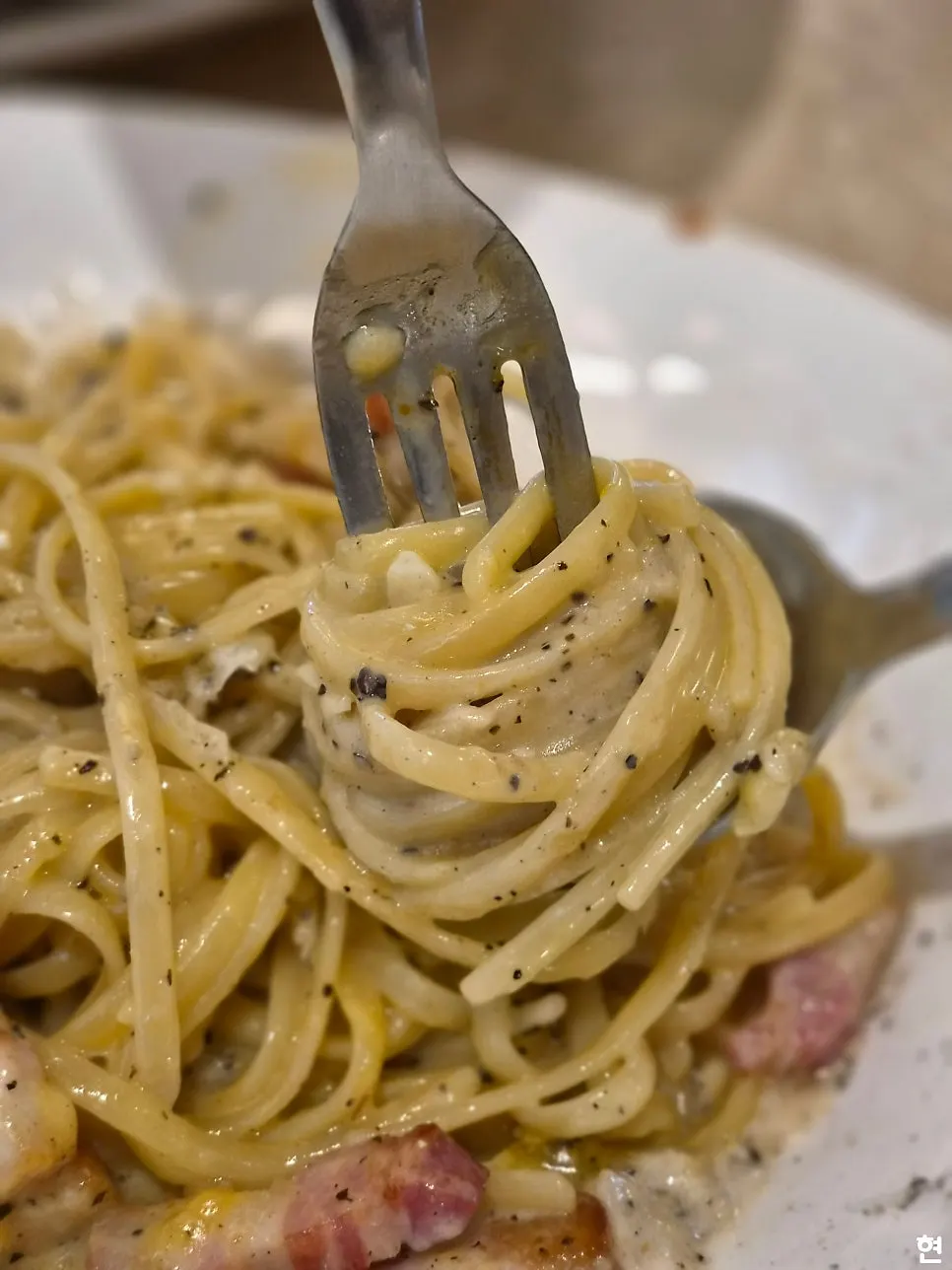 Carbonara noodles with the yolk mixed in
