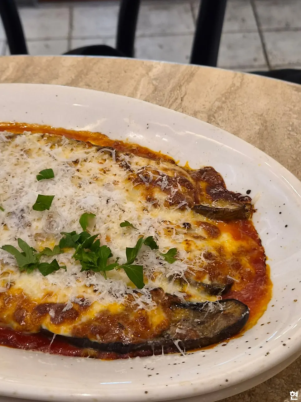 Carbonara and eggplant gratin placed together on the table