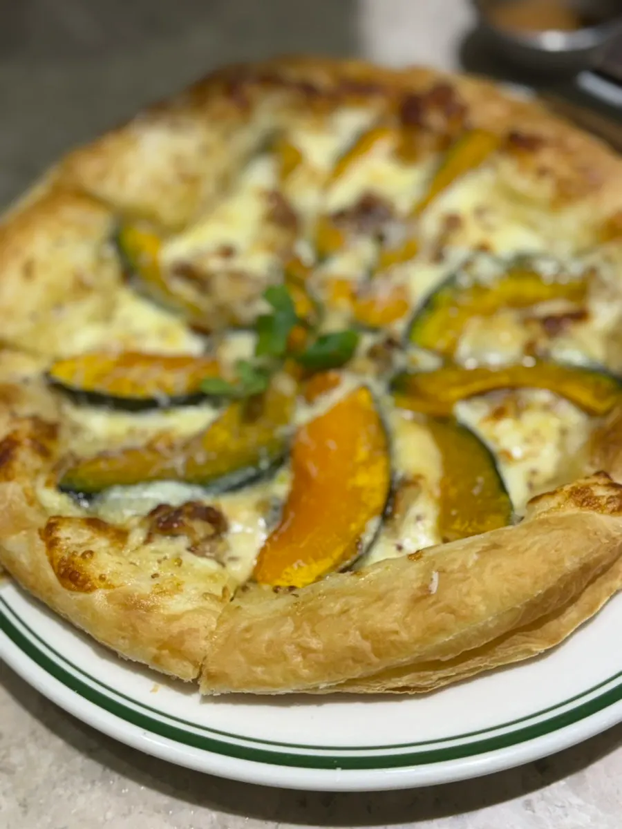 Close-up of the pastry crust on the pumpkin pizza