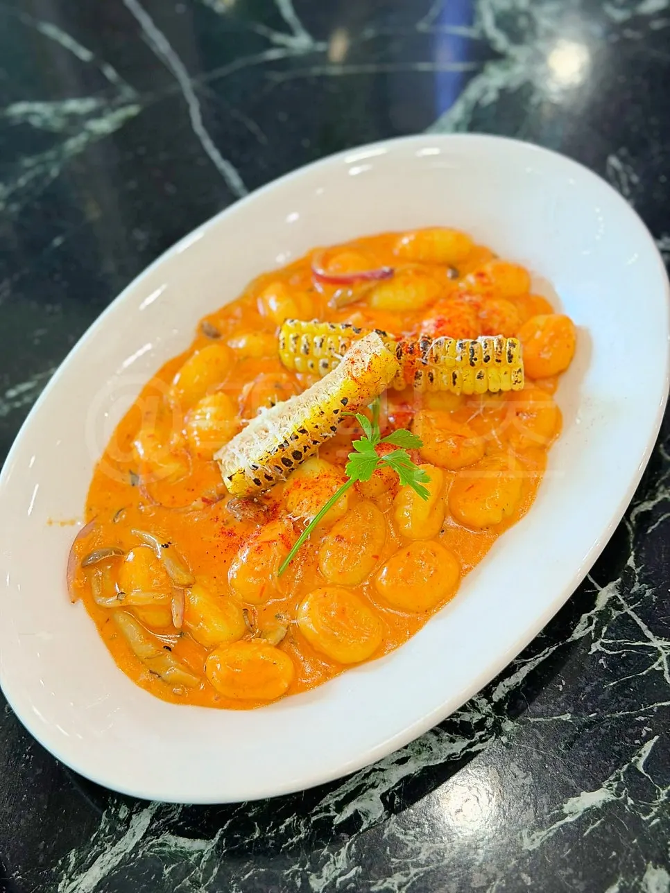 Mela's rose corn gnocchi with red rose sauce
