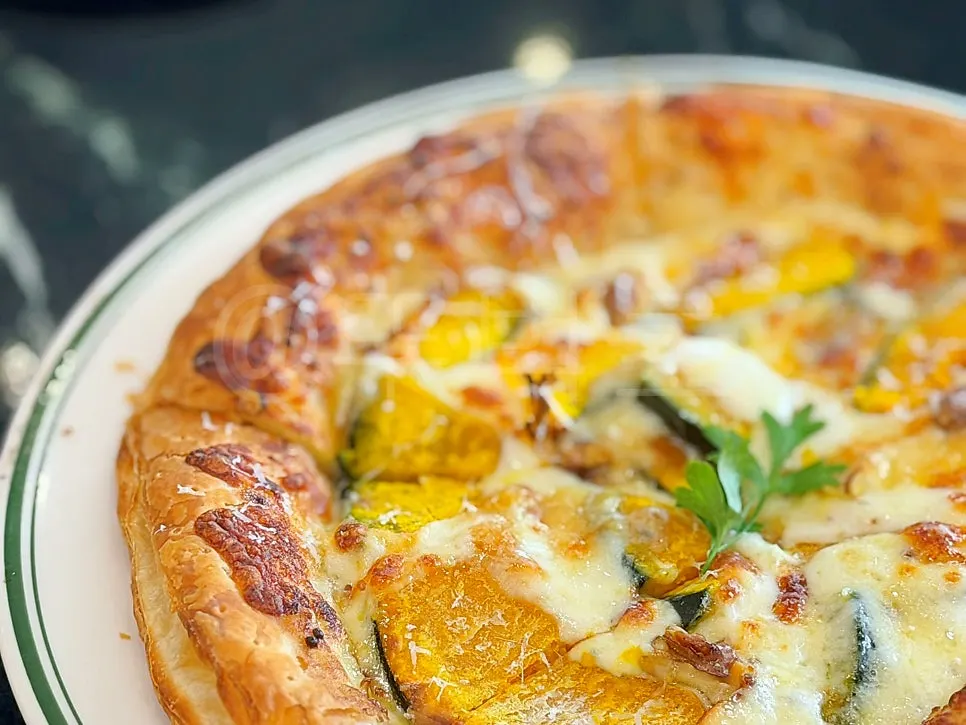 Whole pumpkin pizza with pastry dough