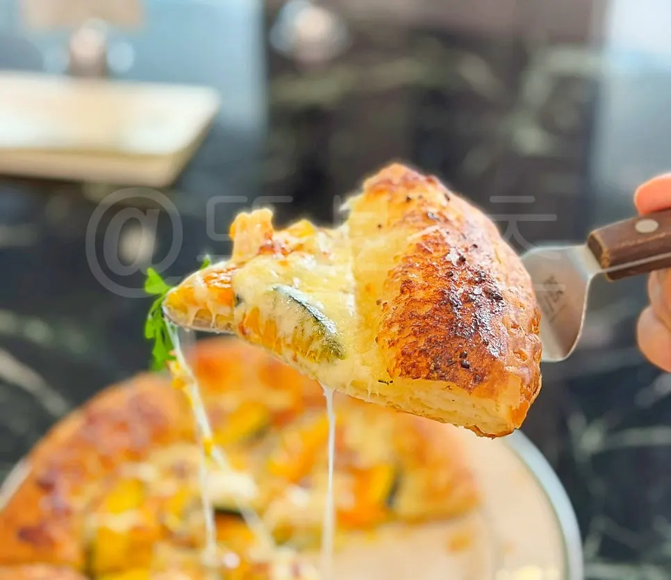 Pumpkin cheese pizza cut into 6 slices