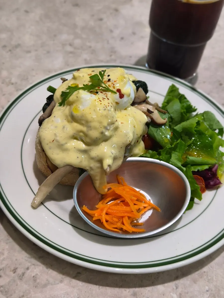 A plate of truffle mushroom eggs benedict