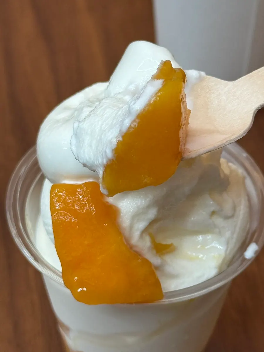 Mango flesh and Sangha Farm milk ice cream