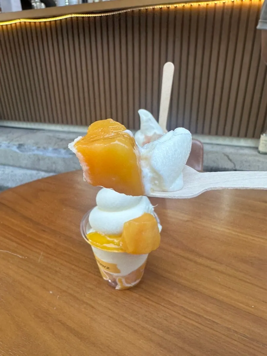 Mellows mango soft serve piled high on milk ice cream