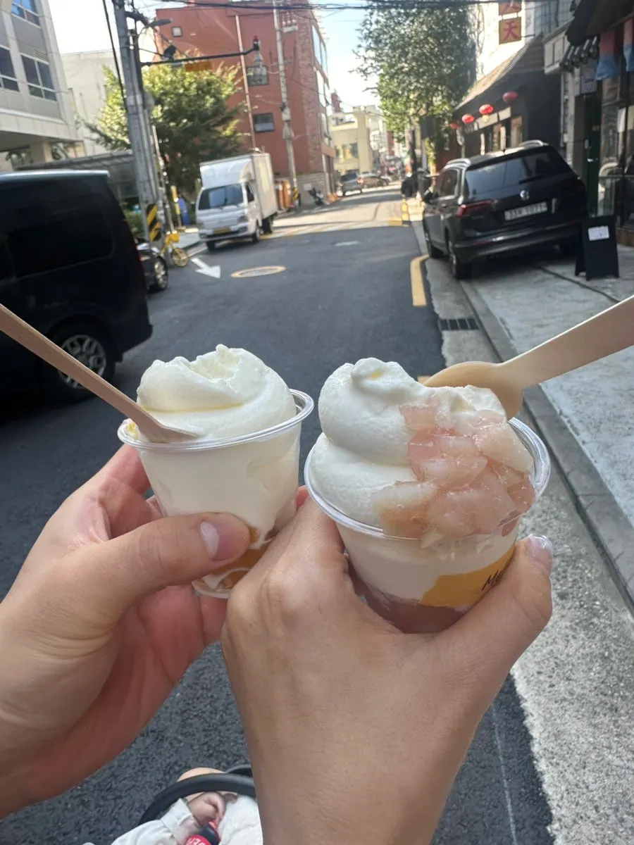 Walking toward Seoul Forest with takeout ice cream in hand