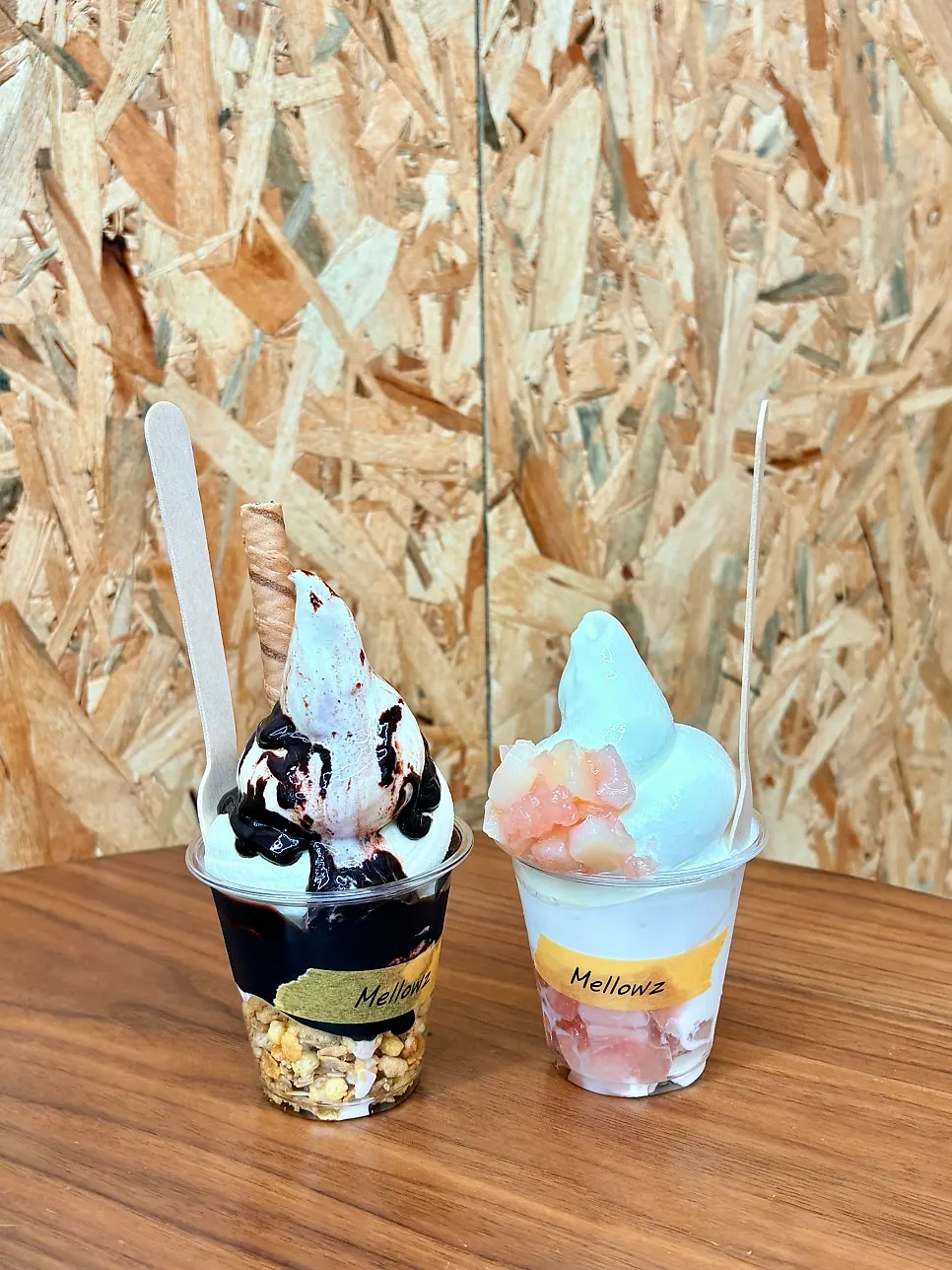Two cups of chocolate and peach soft serve